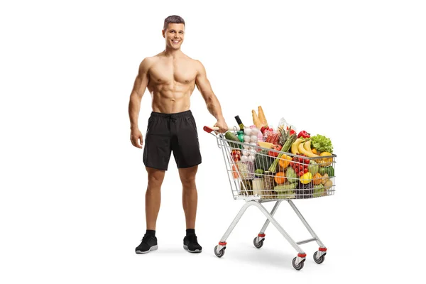 Shirtless Muscular Man Shopping Cart Full Food Isolated White Background — Stok fotoğraf