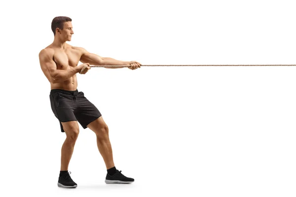 Full Length Profile Shot Strong Young Shirless Man Pulling Rope — Zdjęcie stockowe