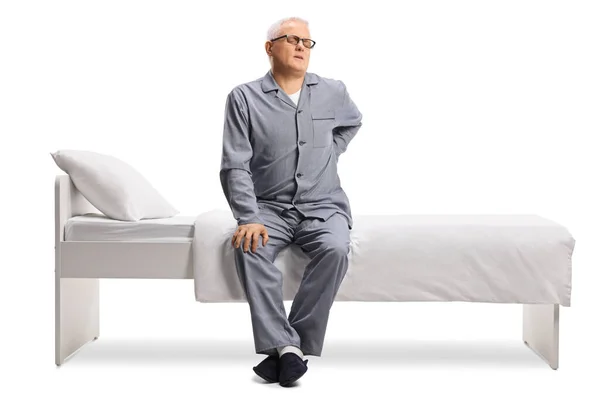 Volwassen Man Pyjama Lijden Aan Rugpijn Een Bed Geïsoleerd Witte — Stockfoto