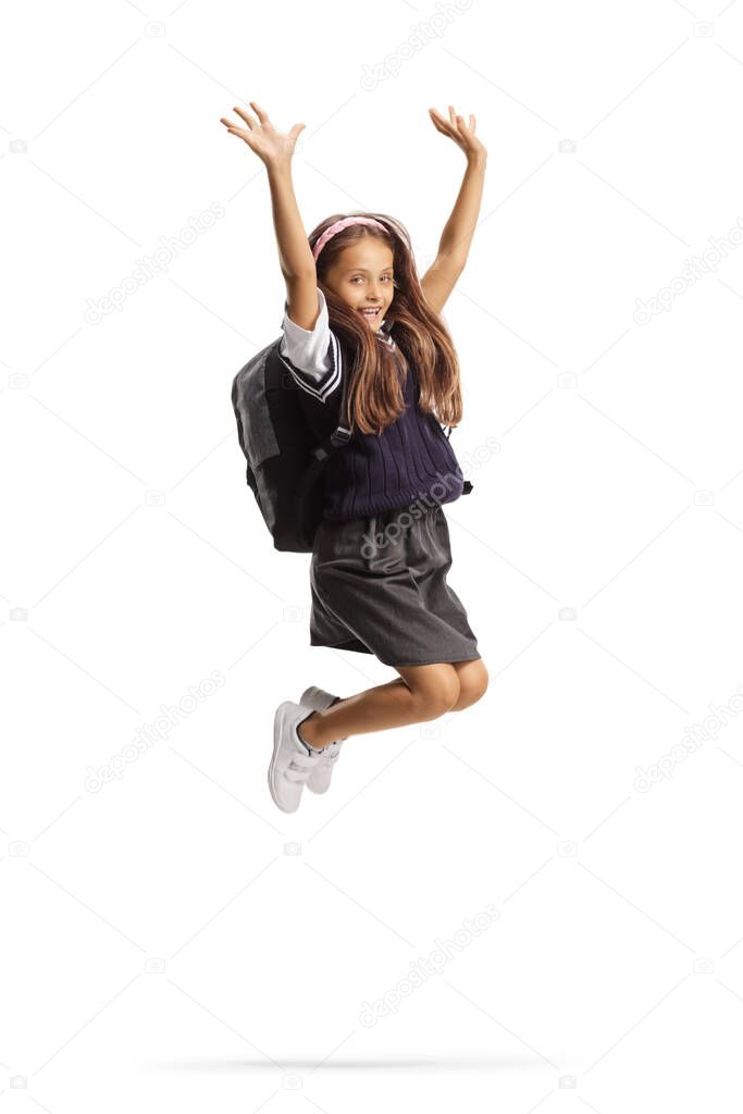Young schoolgirl with long hair jumping and gesturing happiness isolated on white background