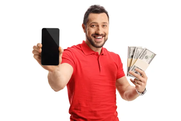 Νεαρός Που Κρατάει Χρήματα Και Ένα Smartphone Απομονωμένο Λευκό Φόντο — Φωτογραφία Αρχείου