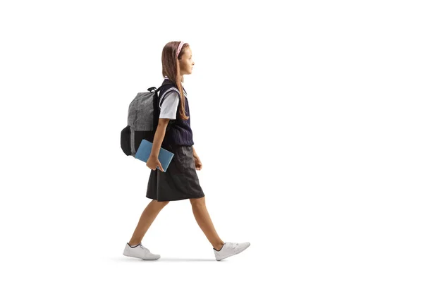 Schoolmeisje Met Boeken Wandelen Geïsoleerd Witte Achtergrond — Stockfoto