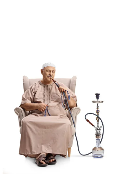 Mature Man Ethnic Clothes Seated Armchair Smoking Shisha Isolated White — Stock Photo, Image