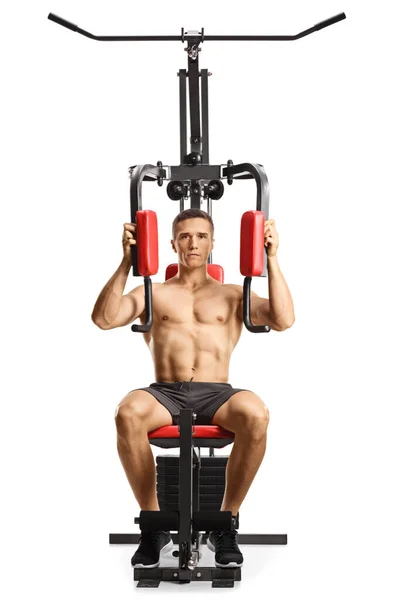 Hemdloser Muskulöser Mann Beim Training Auf Einem Fitnessgerät Isoliert Auf — Stockfoto