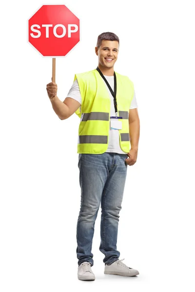 Junger Mann Warnweste Mit Stoppschild Blickt Die Kamera Und Lächelt — Stockfoto