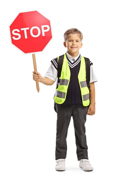 Liten Skolpojke Med Säkerhetsväst Och Stopptrafikskylt Tittar Kameran Och Ler — Stockfoto