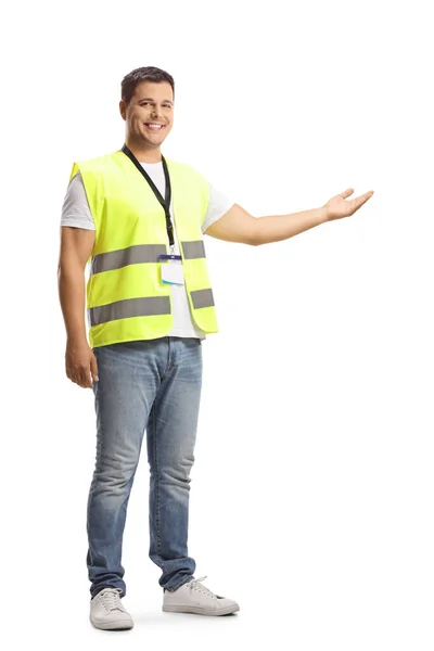 Jongeman Een Veiligheidsvest Met Hand Geïsoleerd Witte Achtergrond — Stockfoto