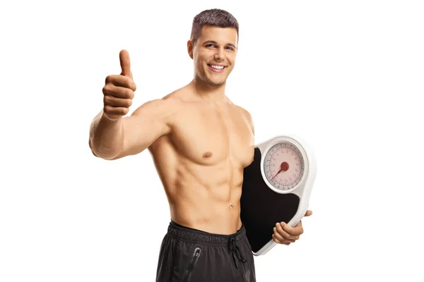 Joven Hombre Topless Sosteniendo Una Escala Peso Gestos Pulgares Hacia — Foto de Stock