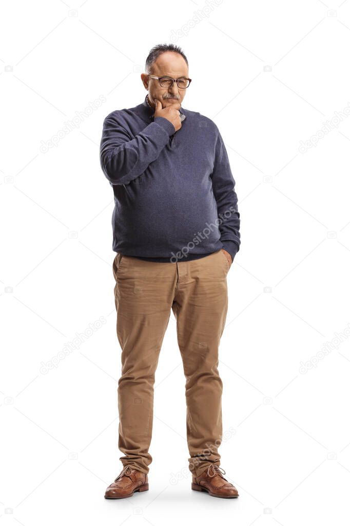 Full length portrait of a pensive mature man standing and thinking isolated on white background