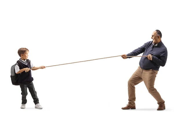 Full Length Profile Shot Little Schoolboy Elderly Man Pulling Rope — Stock Photo, Image