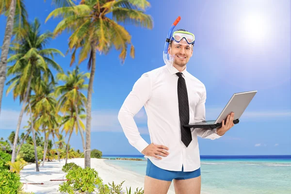 Businessman with mask holding laptop — Stock Photo, Image