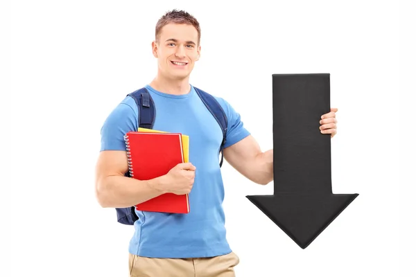 Student holding big black arrow — Stock Photo, Image