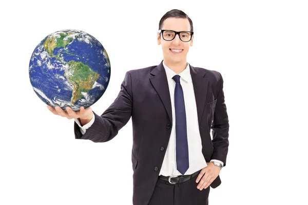 Young businessman holding the earth — Stock Photo, Image