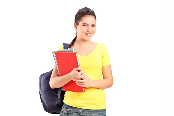 Colegiala sosteniendo libros — Foto de Stock