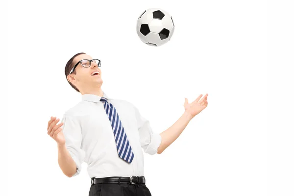 Businessman playing with soccer ball — Stock Photo, Image