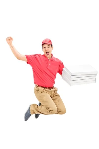 Överlycklig pizza leverans kille hoppar — Stockfoto
