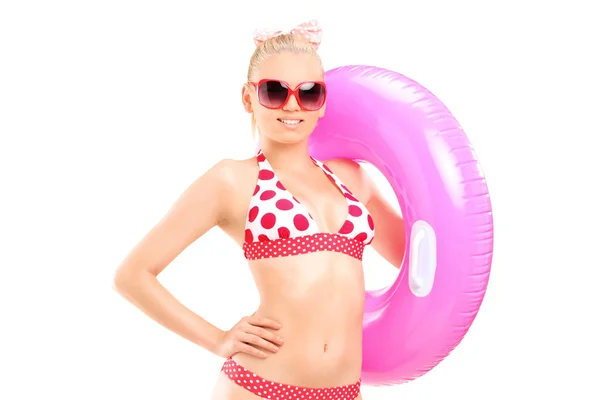 Woman in bikini holding swimming ring — Stock Photo, Image