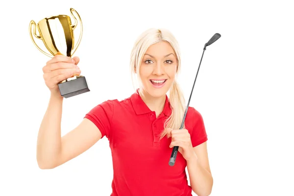 Female golfing champion holding trophy — Stock Photo, Image