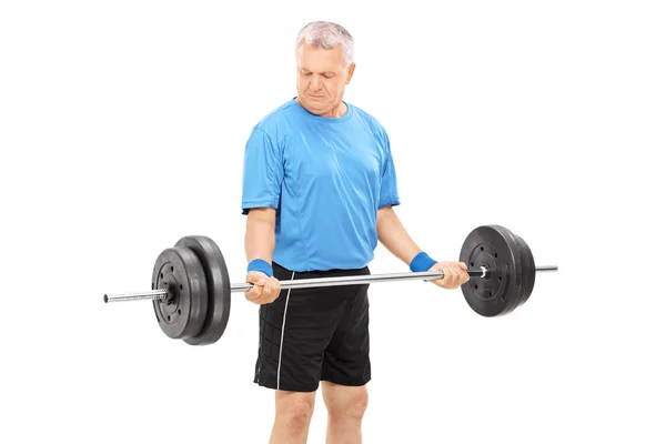 Mature man with heavy barbell — Stock Photo, Image