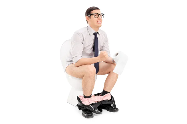 Man having hard time on toilet — Stock Photo, Image