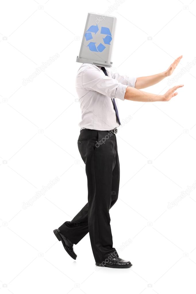 Man with recycle bin over head