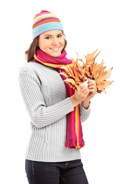 Girl with hat holding leaves — Stock Photo, Image