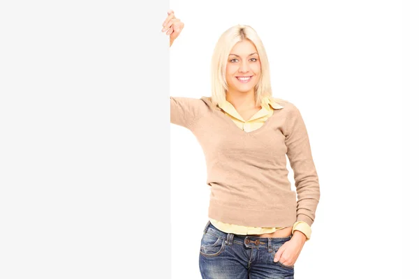 Woman standing next to panel — Stock Photo, Image