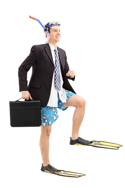 Businessman walking with scuba fins — Stock Photo, Image