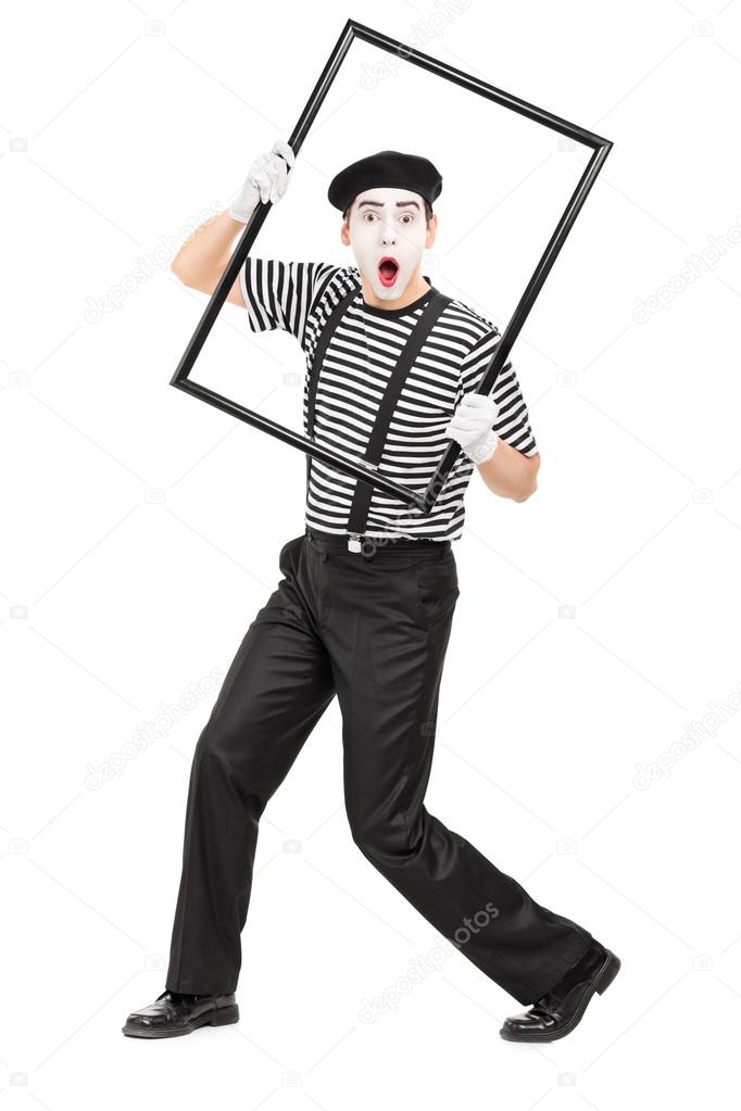 Mime artist holding picture frame