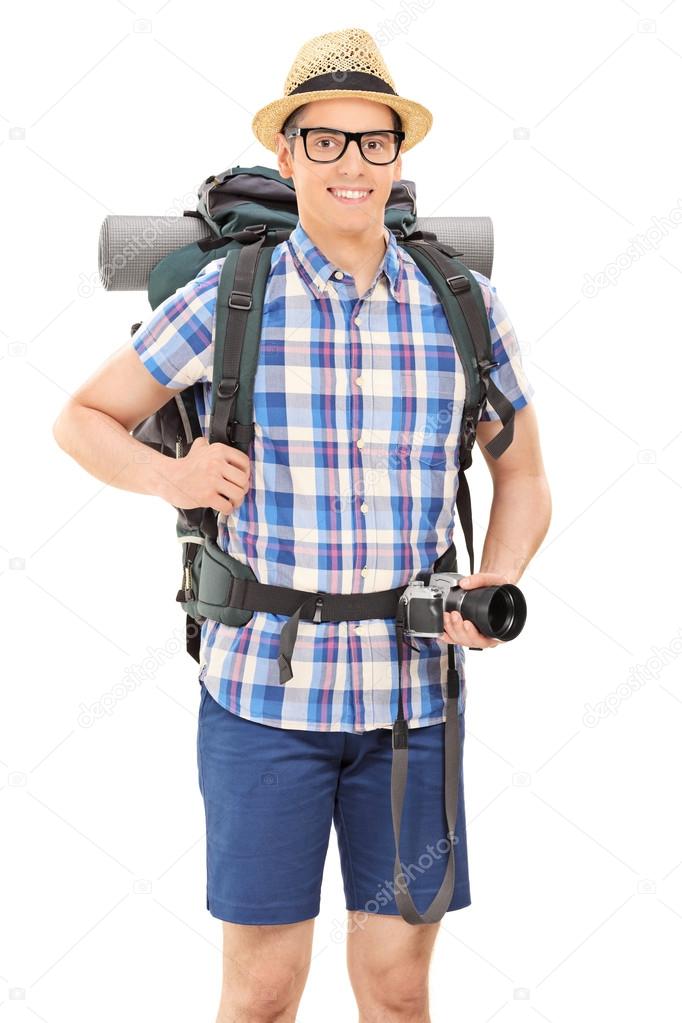 Male hiker holding camera