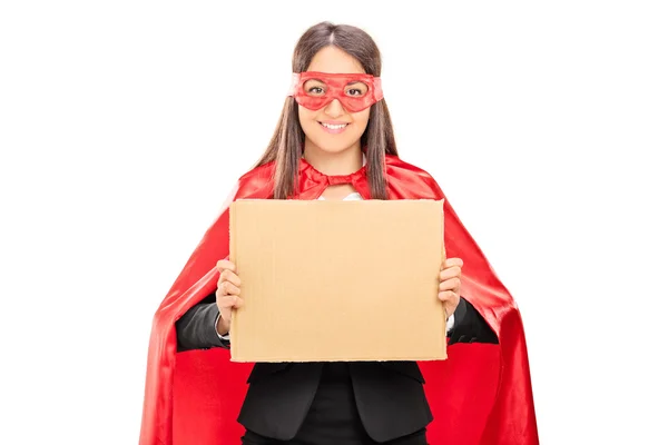 Female superhero holding blank sign — Stock Photo, Image