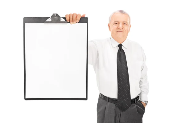 Mature businessman holding clipboard — Stock Photo, Image