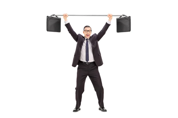 Businessman lifting two briefcases on bar — Stock Photo, Image