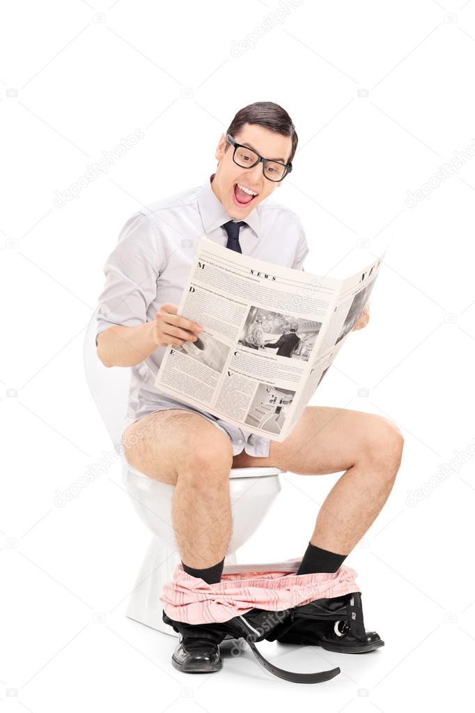 Man reading news on toilet