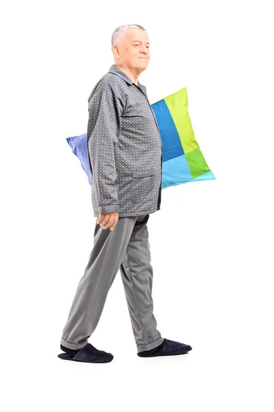 Senior in pajamas holding pillow — Stock Photo, Image