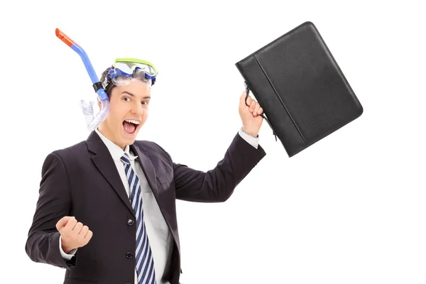 Businessman with diving equipment holding bag — Stock Photo, Image