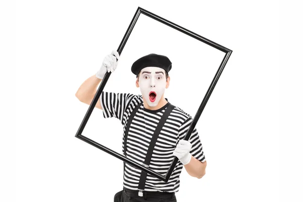 MIME-konstnär håller bildram — Stockfoto