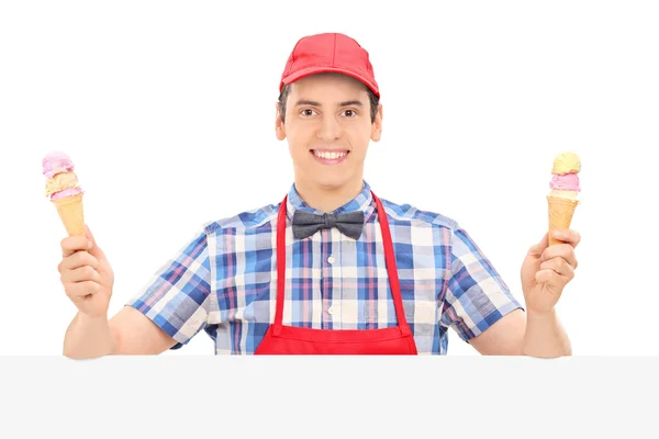 Male vendor holding two ice creams — Stock Photo, Image