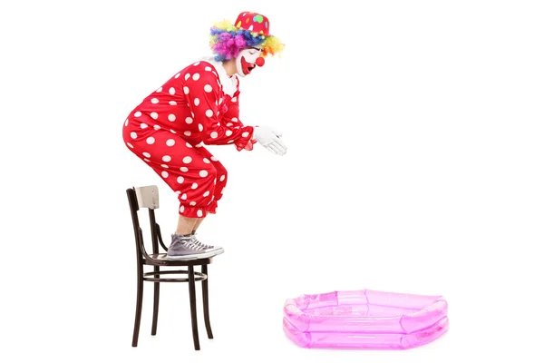 Clown preparing to jump into pool — Stock Photo, Image