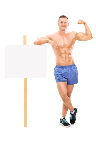 Muscular man showing bicep — Stock Photo, Image