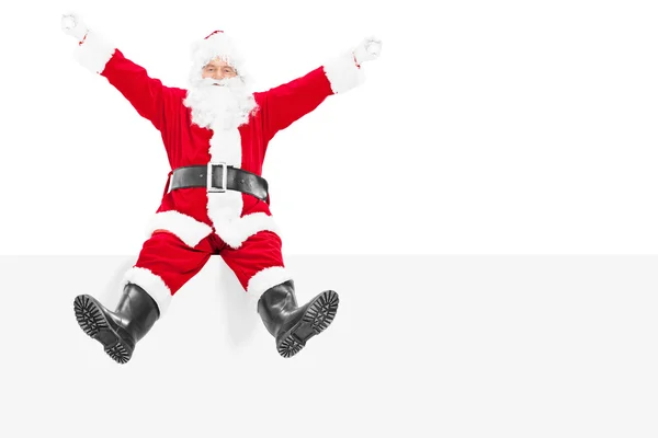 Santa Claus sentado en el panel en blanco —  Fotos de Stock