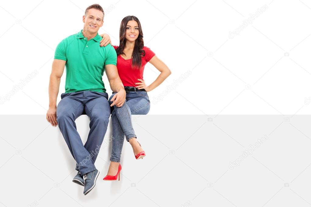 Couple sitting on blank panel