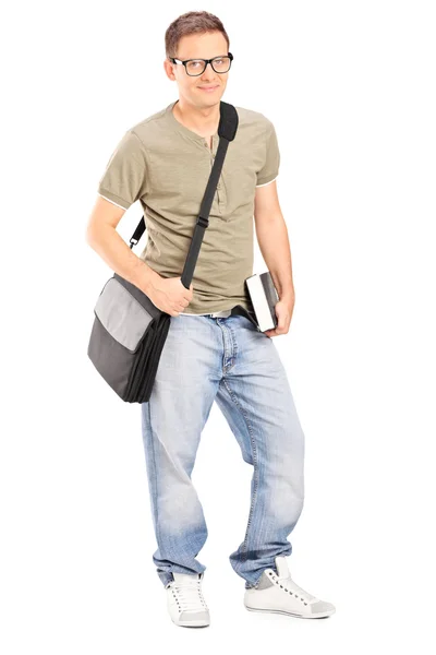 Young male student holding book — Stock Photo, Image