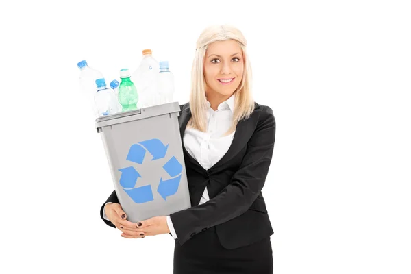 Young businesswoman holding recycle bin — Stock Photo, Image