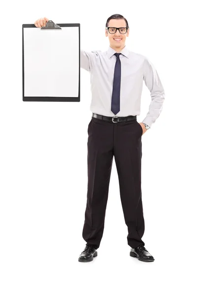 Young businessman holding clipboard — Stock Photo, Image