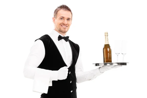 Garson holding şampanya ve bardak — Stok fotoğraf