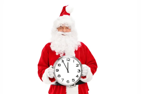 Santa claus drží nástěnné hodiny — Stock fotografie