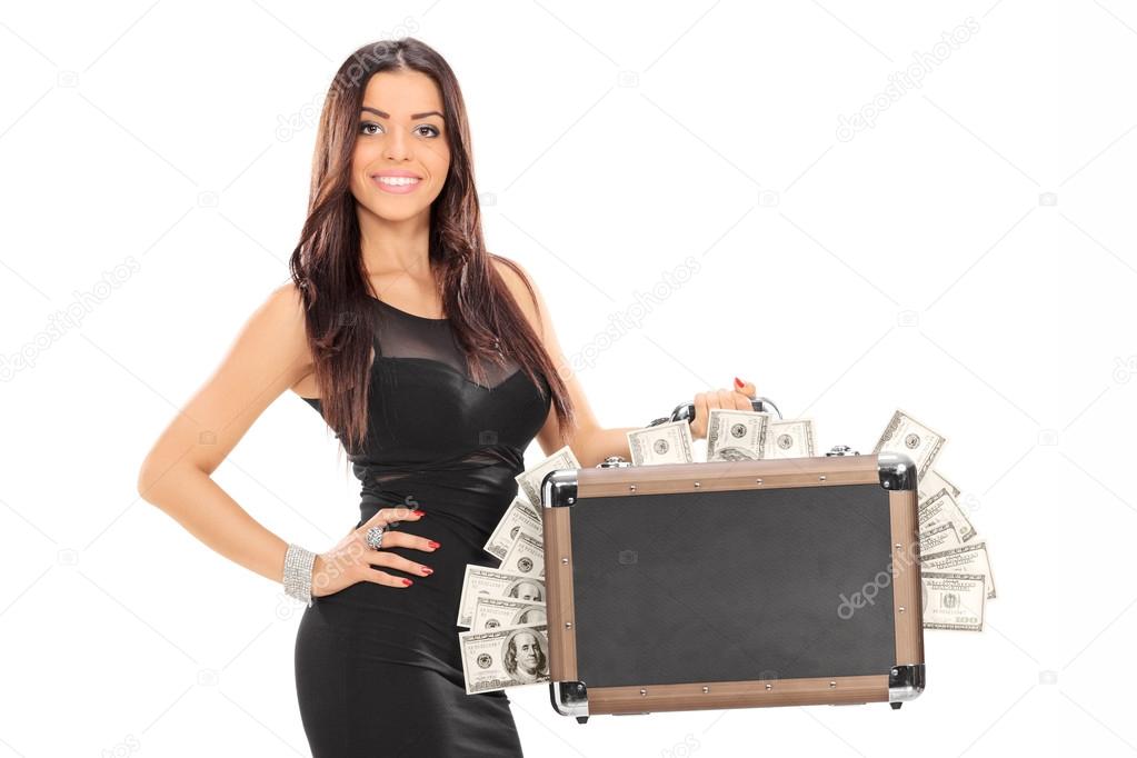 Woman holding briefcase full of money