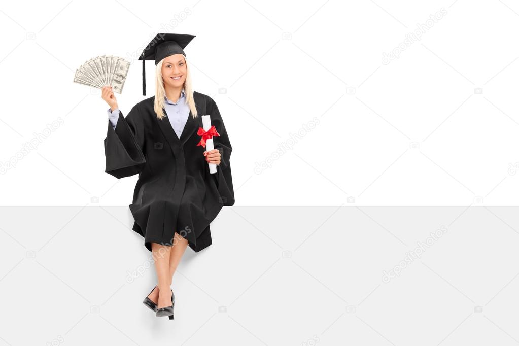 Female graduate holding money