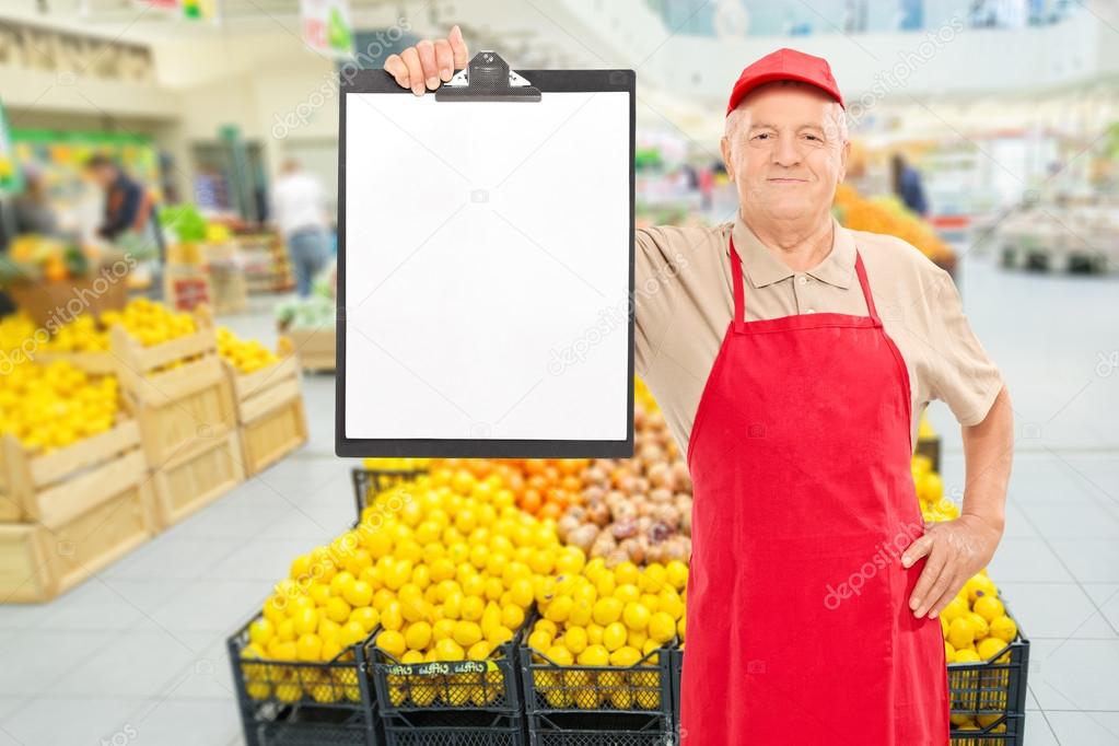 Market vendor holding clipboard